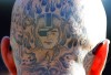 http://www.totalprosports.com/wp-content/uploads/2009/10/raiders-head-tattoo-462x400.jpg