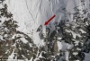 http://www.totalprosports.com/wp-content/uploads/2009/12/Snowboarder-Clings-to-Edge-of-Cliff-For-His-Life-520x295.jpg
