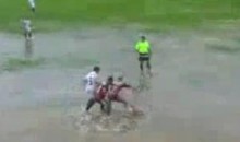 Brazilian Soccer Match Goes On Despite Flooded Pitch (Video)