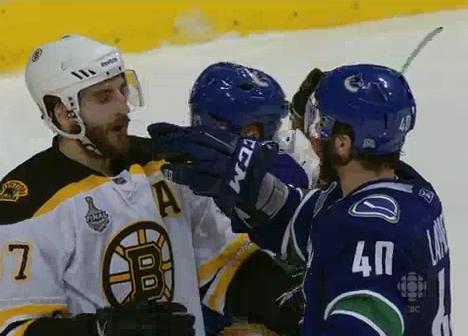 Maxim-Lapierre-Taunts-Patrice-Bergeron-With-A-Finger-To-The-Mouth.jpg