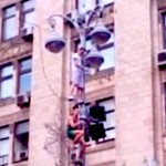 fans climb light pole at euro 2012