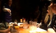 Drunk Ravens Fan (Unsuccessfully) Celebrates Victory by Running Across Tables at a Restaurant (Video)
