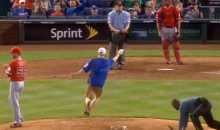 Royals Fan Runs onto Field and Steals Rosin Bag from Pitching Mound (Video)