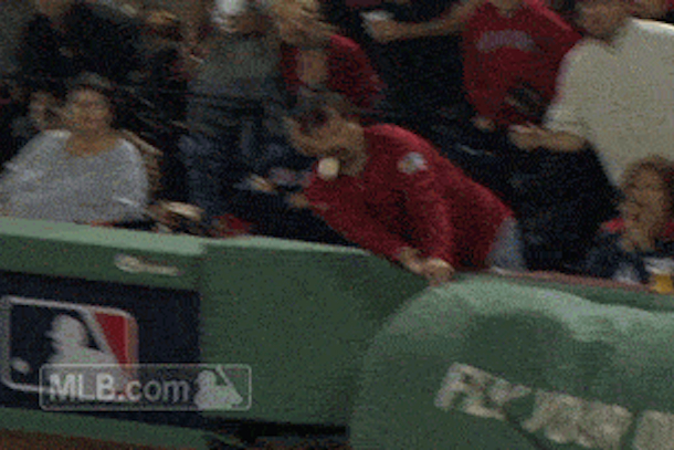 red sox fan takes foul ball to face