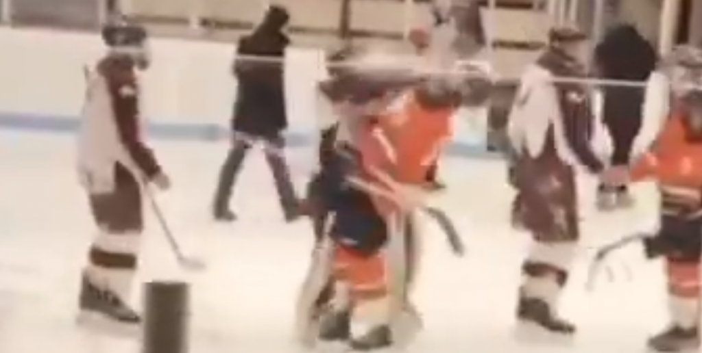 hockey coach trips kid in handshake line