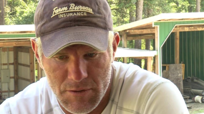 Brett Favre wearing a baseball hat with an unshaven face