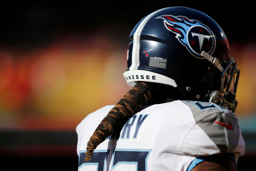 The back of Derrick Henry in a Titans uniform with his hair in a cone shape
