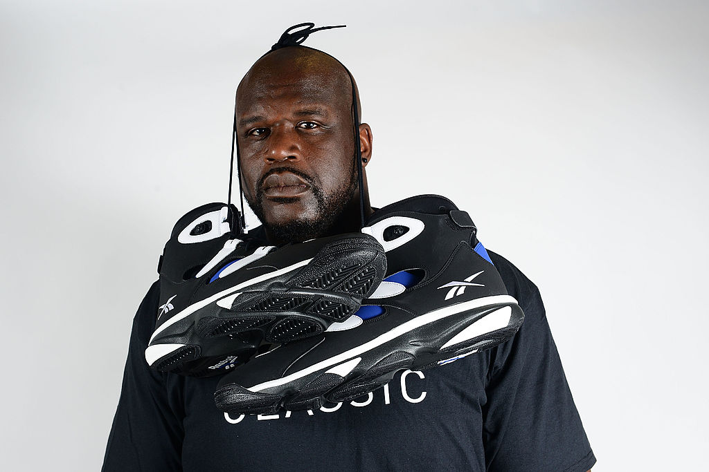 shaquille o'neal poses with his reebok shoes