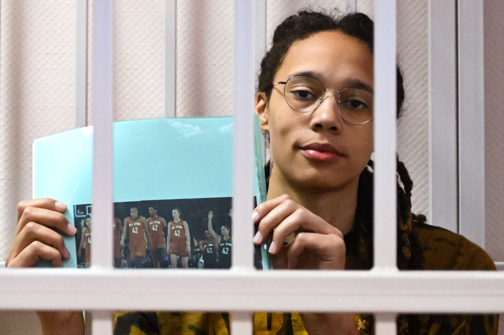 Brittney Griner holding up photo while in lockup