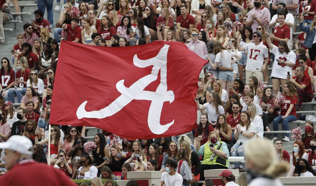 Alabama Crimson Tide fans cheer in the stands. 