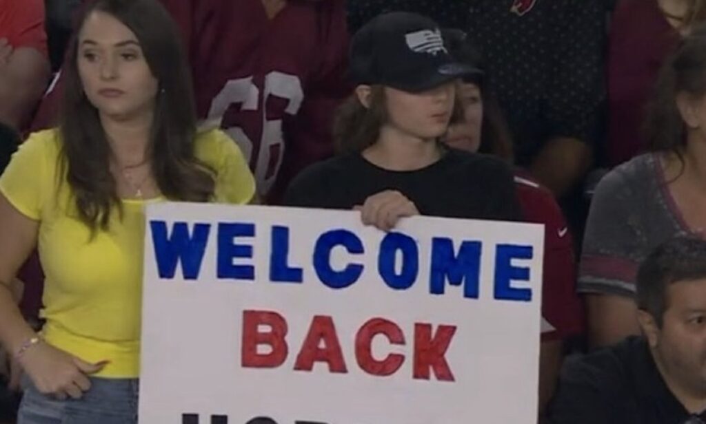 Arizona Cardinals fan holds up a DeAndre Hopkins welcome back sign.