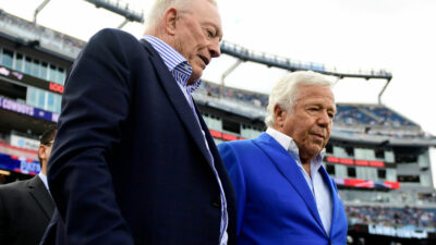 Jerry Jones & Robert Kraft stand next to each other before game in 2021