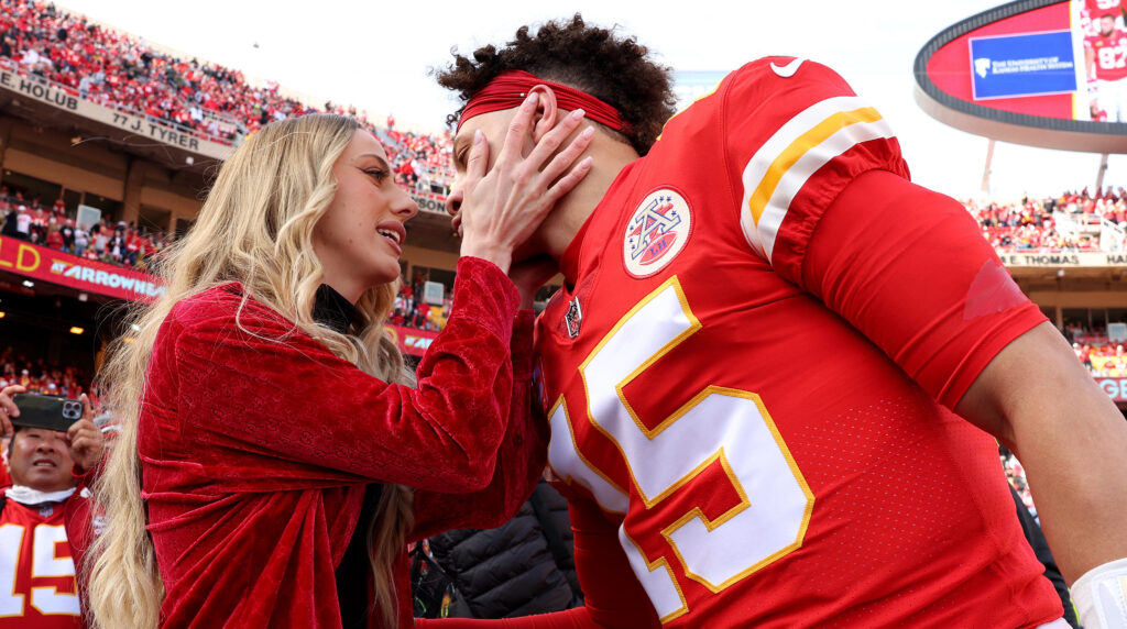 Brittany Mahomes kisses her husband Patrick before a game.