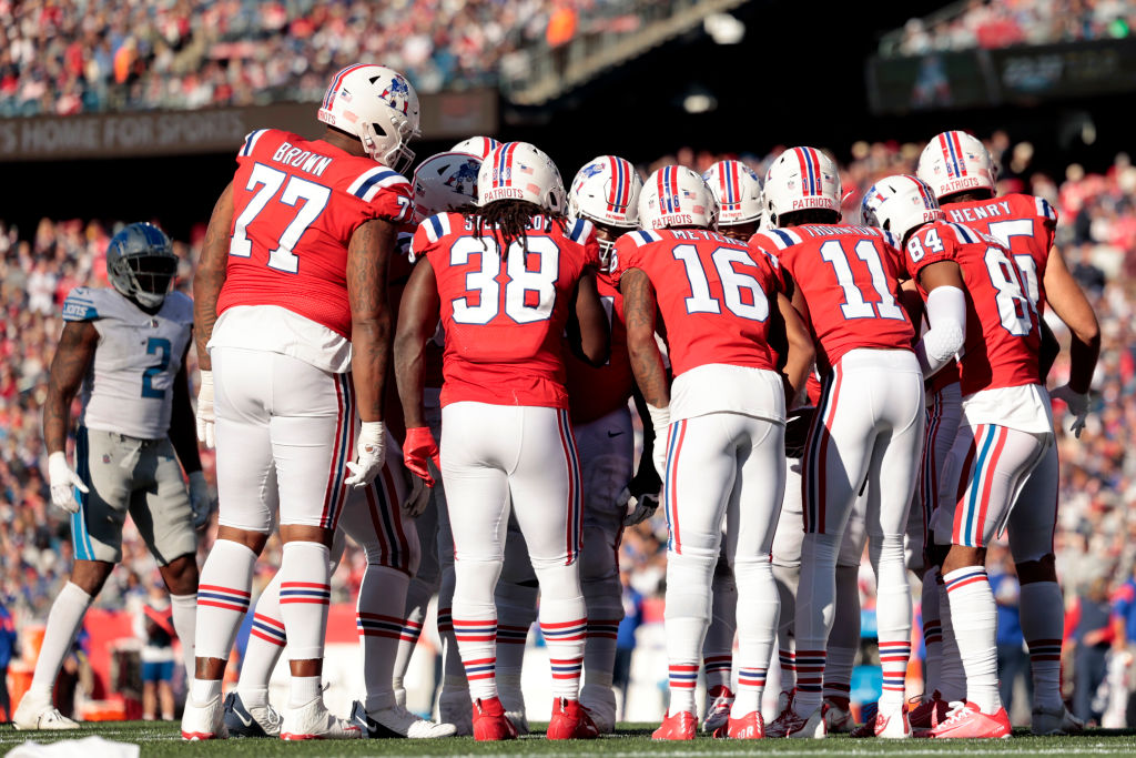 New England Patriots players in a huddle