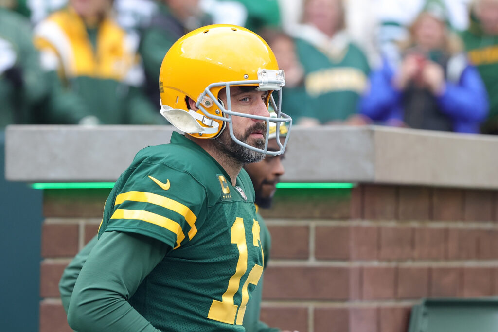 Green Bay Packers QB Aaron Rodgers looks on from the sideline.