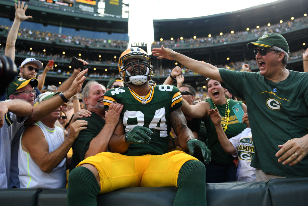 Lance Kendricks seated in stands with Packers fans