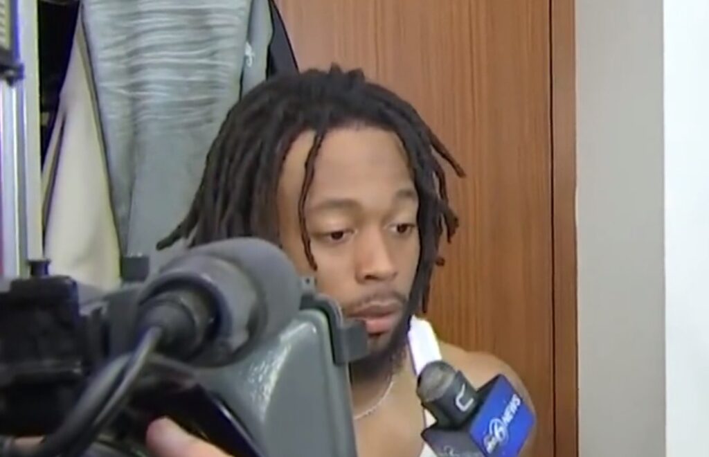 Jakobi Meyers at locker with mic in his face