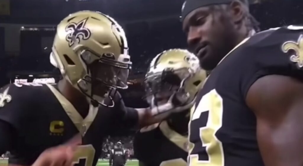 Saints quarterback Jameis Winston rapping to two of his teammates.