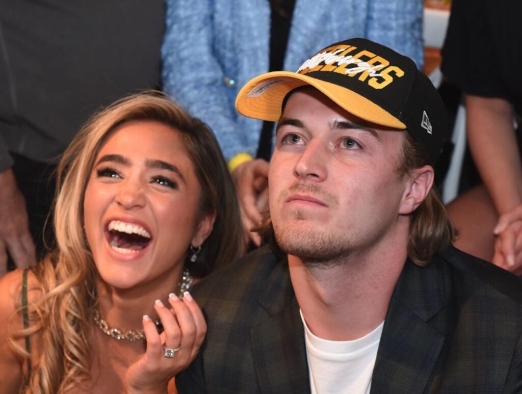 Kenny Pickett gets drafted to the Steelers with fiance Amy Paternoster smiling at his side.