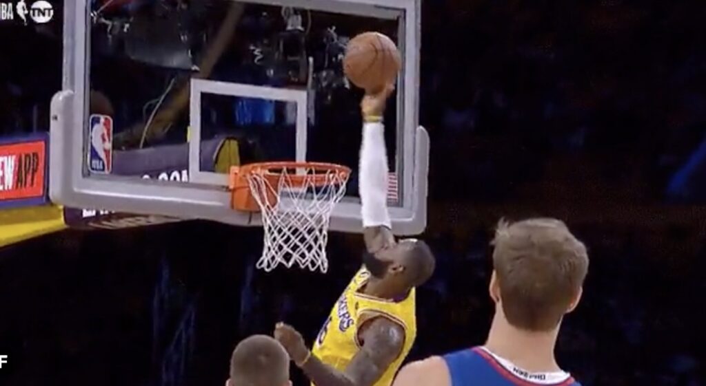 LeBron James blocks a shot from the Clippers' John Wall.