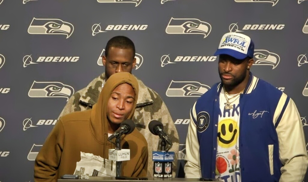 Tyler Lockett at podium with Geno Smith and DK Metcalf