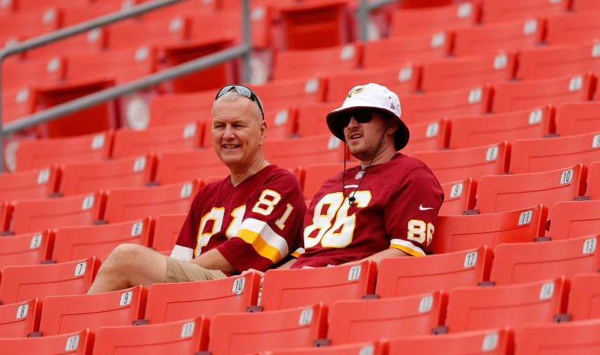 Washington Commanders fans sitting in the stands.