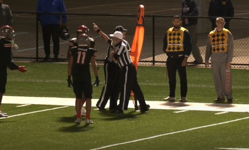 ref signaling a first down