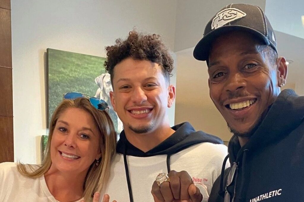 Patrick, Randi, and Pat Mahomes taking a selfie picture together.