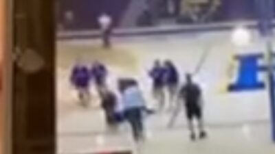 Volleyball player surrounded after taking ball to the face