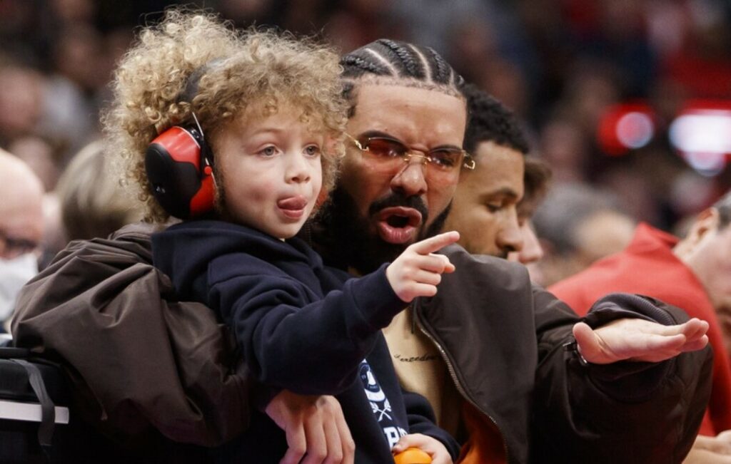 Toronto Raptors global ambassador Drake and his son at team game.