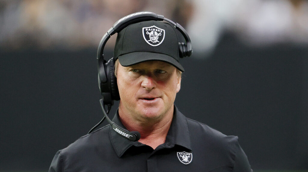 Former Raiders head coach Jon Gruden looks on with his headset on.
