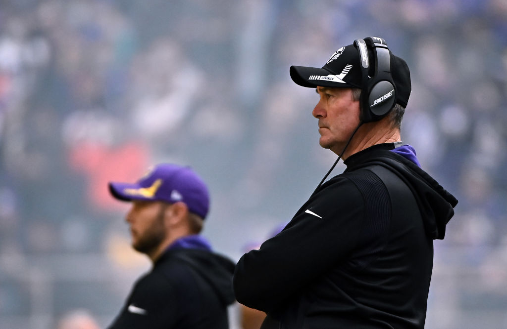 Mike Zimmer with headset on on sidelines