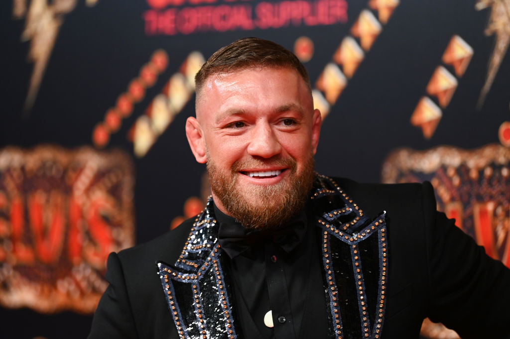 Conor McGregor smiling and posing