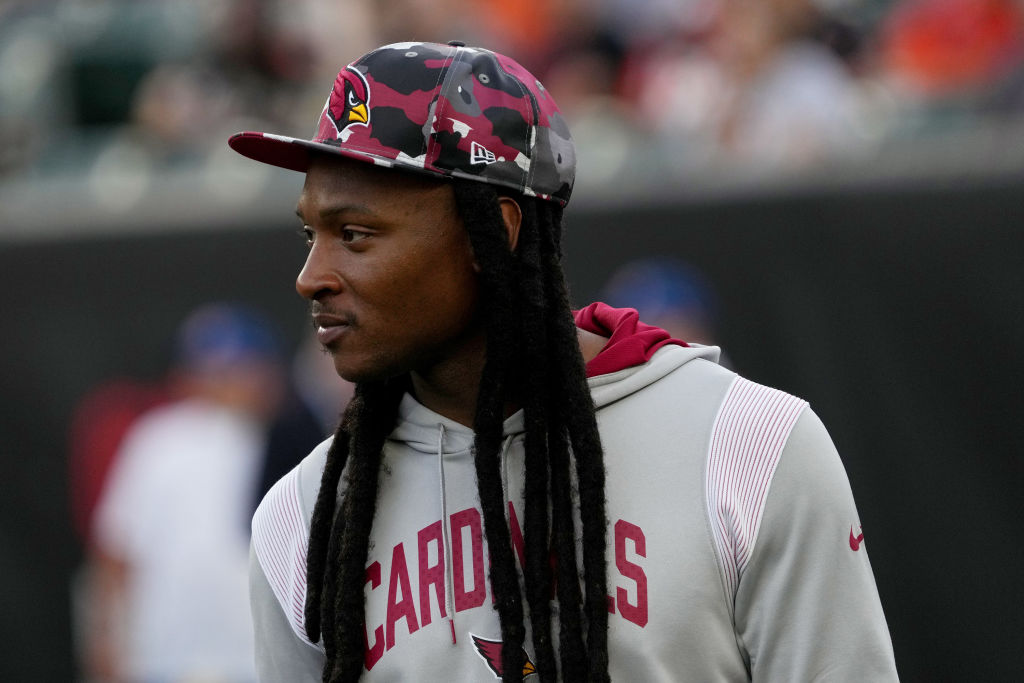 deandre hopkins with a Cardinals hat and hoodie on