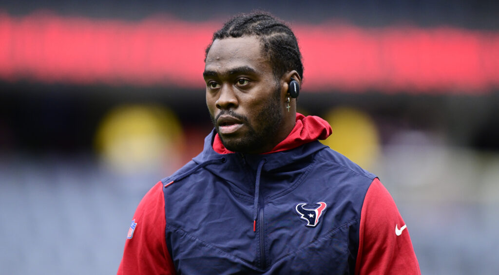 Brandin Cooks warms up in a sweatsuit before a Texans game.