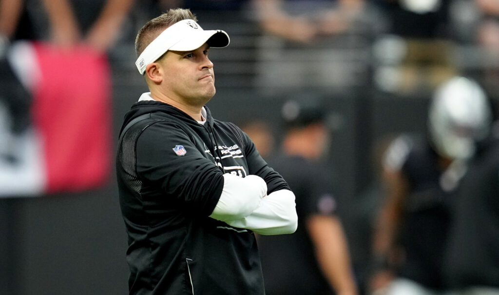 Raiders head coach Josh McDaniels looks on.