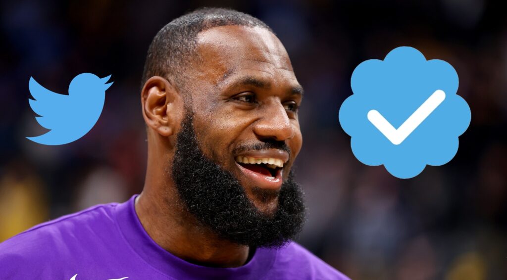 LeBron James laughs with the twitter symbol and blue checkmark on both sides of his head.