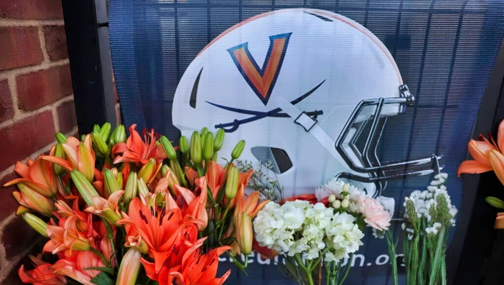 A memorial with flowers for the three Virginia players who were shot and killed.