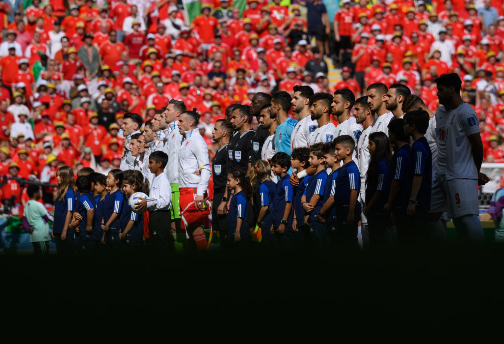 Iran team standing for National Anthem