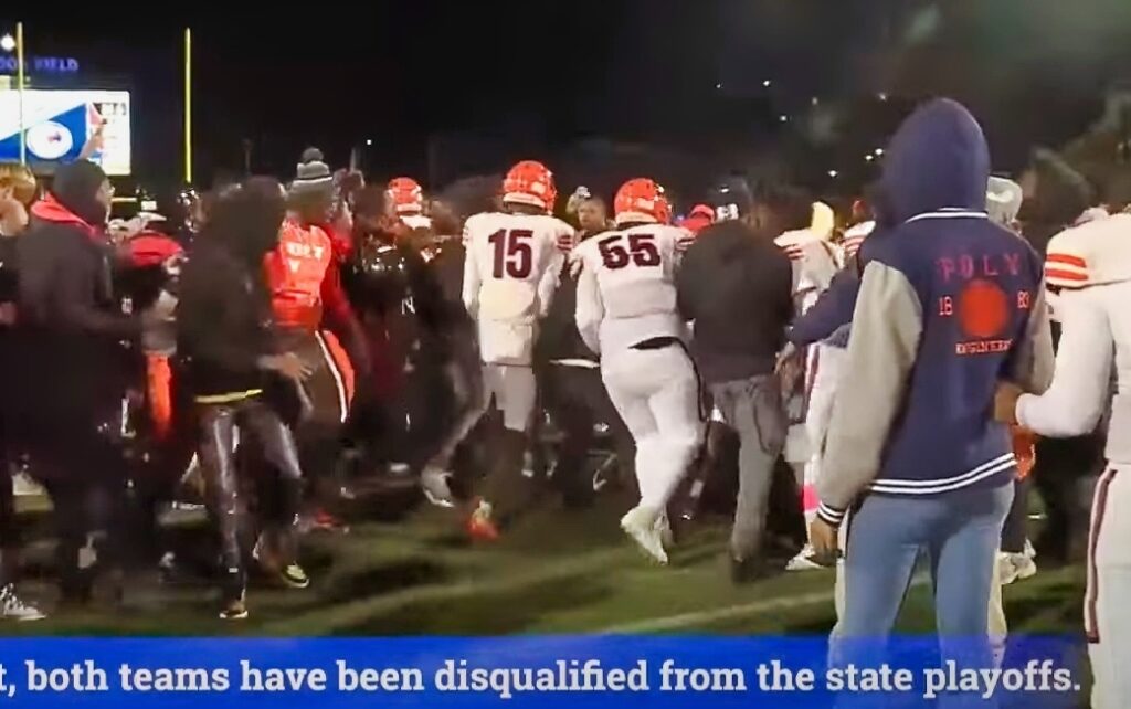 two high school teams with players and staff fighting on field