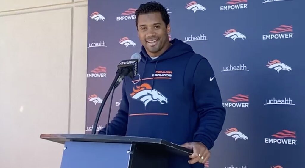 Russell Wilson speaks at a press conference.