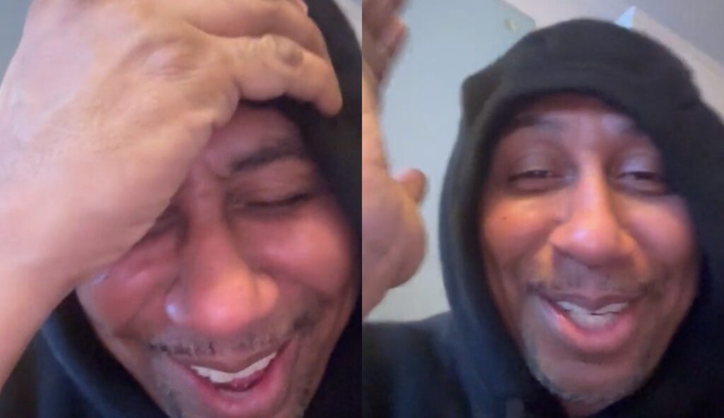 Stephen A. Smith laughing with hoodie on