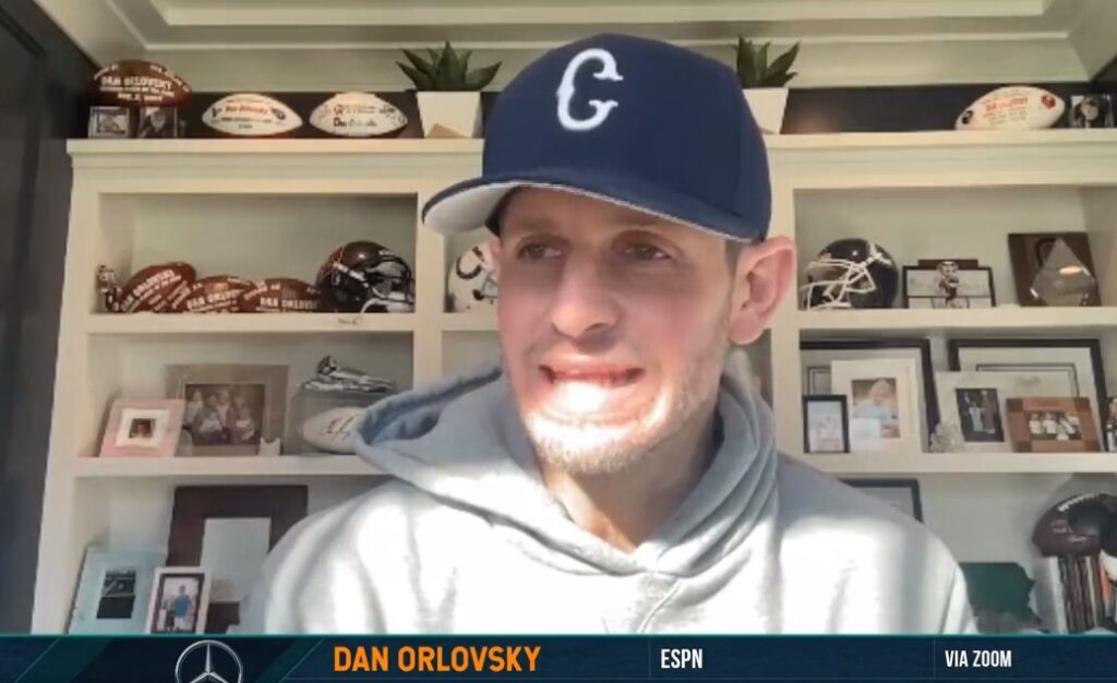 Dan Orlovsky with hat on doing interview from home