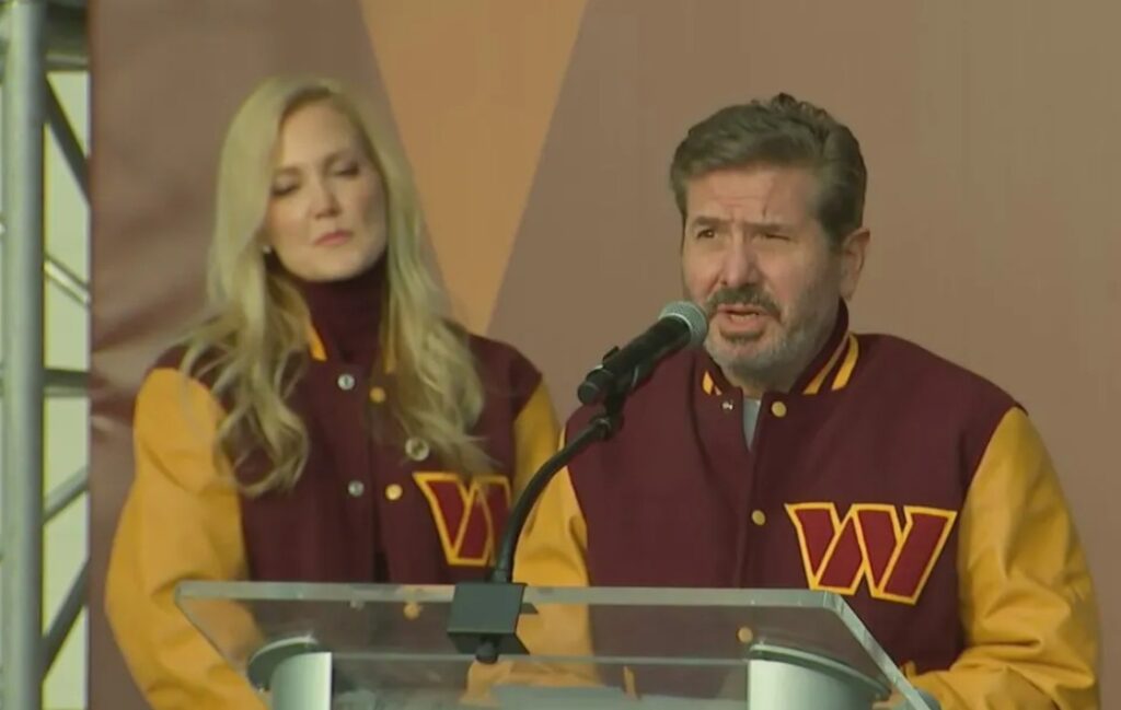dan snyder and his wife, tanya standing at podium