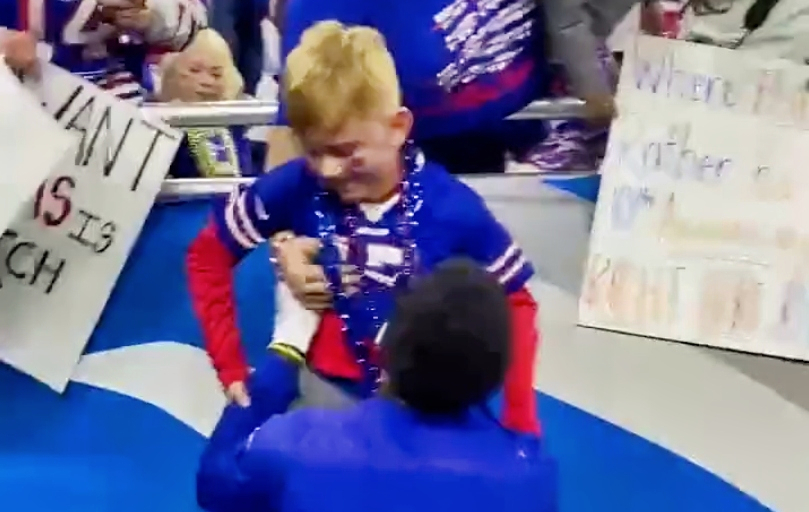 Buffalo bills wideout Stefon Diggs with a young fan.