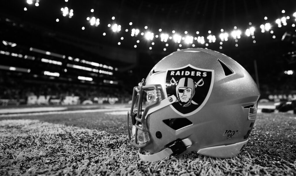 Raiders helmet on field.
