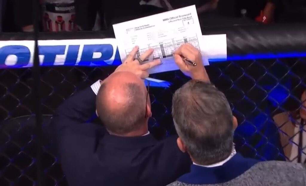 scorecard being written on during UFC match