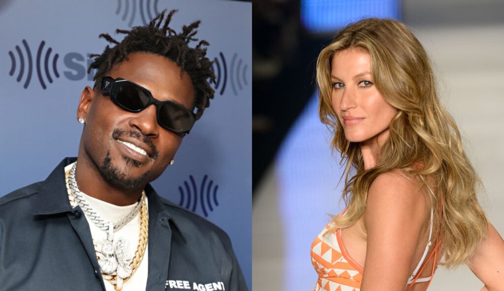 Antonio Brown posing with glasses on while Gisele is posing on runway