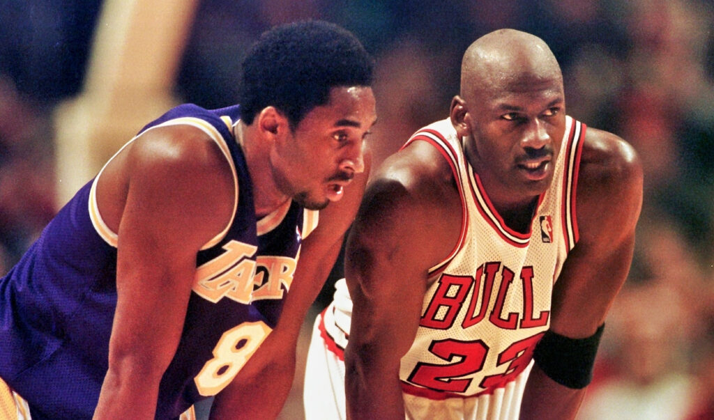 Kobe Bryant and Michael Jordan side by side during a game.