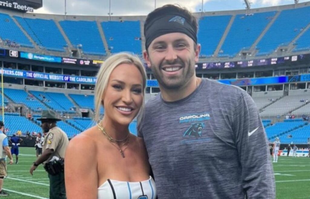 Baker Mayfield posing with his wife
